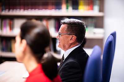 Three people at a desk